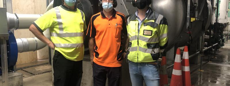Matthew Bain, Project Manager, Essity AustralAsia (in the middle) pictured with Runtech Systems start-up team Hannu Kääriä, Sales Director, APAC, (left) and Toni Raja, Project Manager, in front of the new EP600 Turbo Blower.
