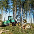 A Timberjack wheeled harvester stacks cut timber in Finland. Photo: Wikipedia Commons, credit: Heikki Valve.