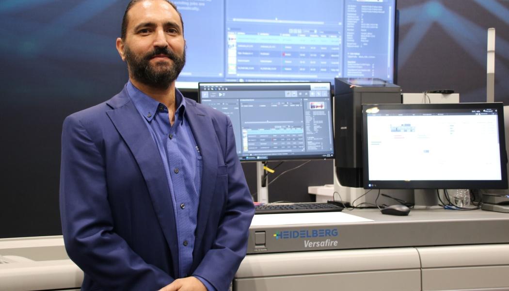 JohnHenry Ruggieri, president of SunDance, with the company's new Heidelberg Versafire digital printer. Photo: SunDance