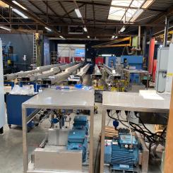 ProJet equipment during FAT; the traverse beams are over 15.0 meters long because of the width of the Domtar machine.