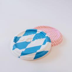 Dry Molded Fiber samples with examples of Seaman Paper’s patterned barrier crepe paper. Photo: PulPac