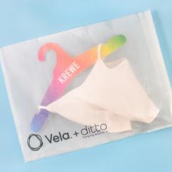 Vela, an award-winning alternative to single-use plastic. Here, a Vela bag is paired with a paper fiberboard hanger from Ditto Hanging Solutions, a subsidiary of Nexgen Packaging. Photo: Ditto Hanging Solutions/Nexgen Packaging